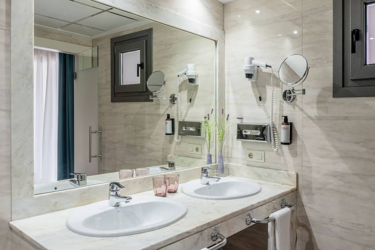 superior room | bathroom | shower, hair dryer, towels