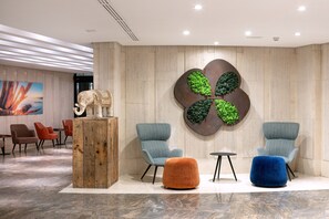Relax in style with plush armchairs and a vibrant atmosphere.