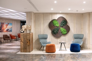 Relax in style with plush armchairs and a vibrant atmosphere.