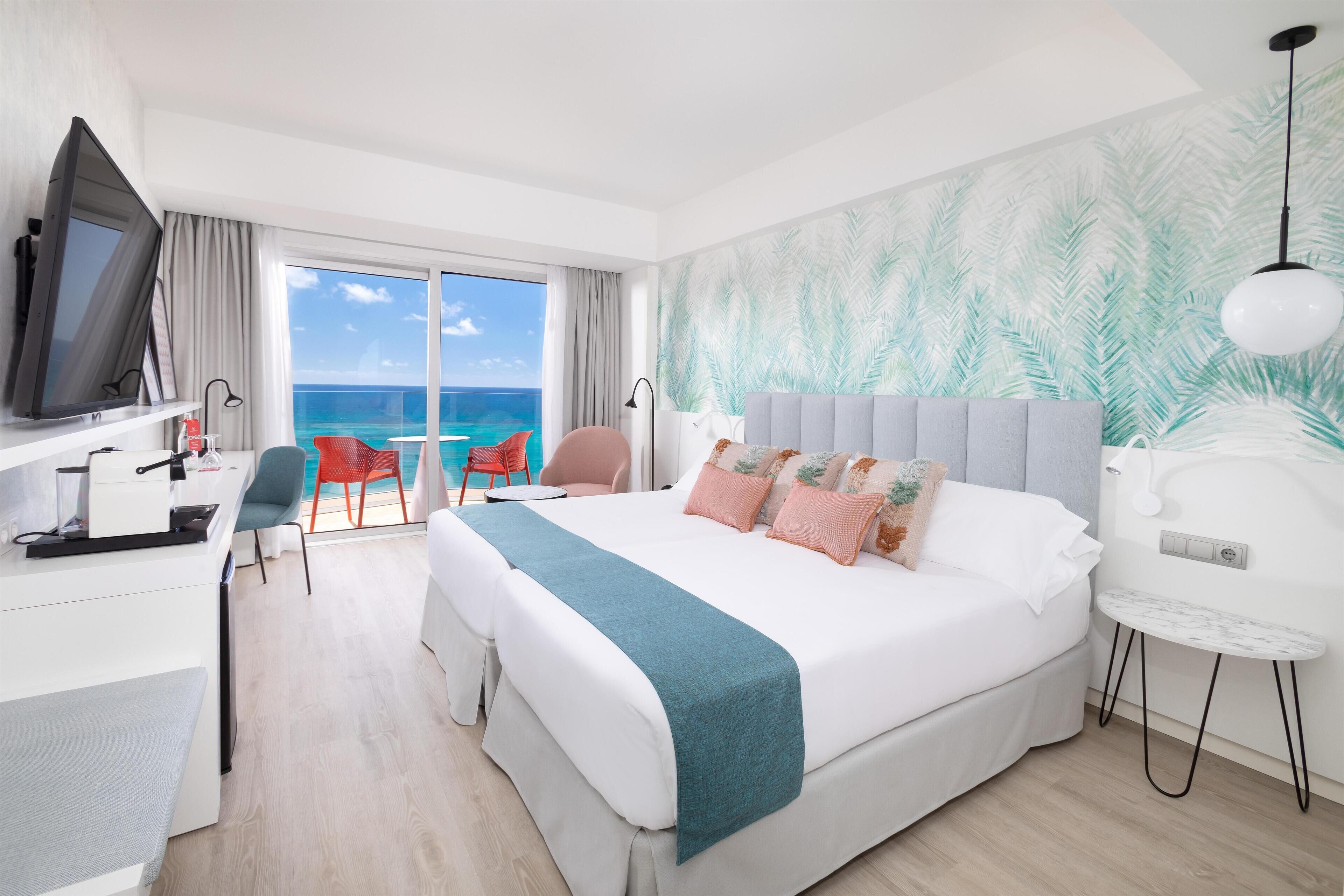 Deluxe Room Beach View (2 Adults) | Down duvets, minibar, in-room safe, desk