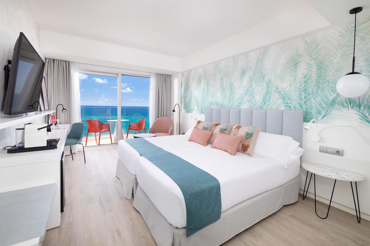 Deluxe Room Beach View (2 Adults) | Down duvets, minibar, in-room safe, desk