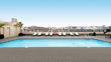 Outdoor pool, open 10:00 AM to 6:00 PM, pool umbrellas, pool loungers