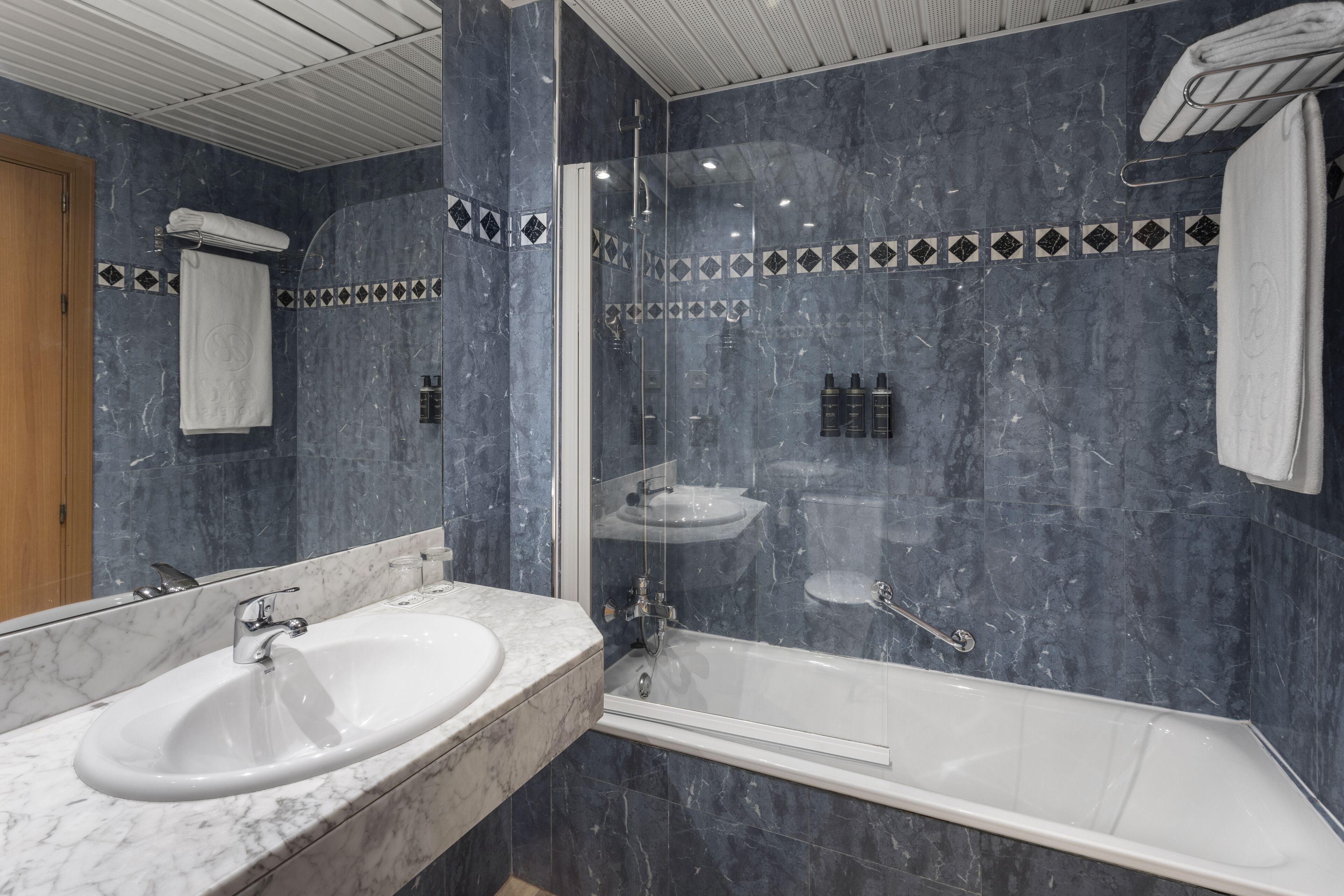 eco-friendly toiletries, hair dryer, towels