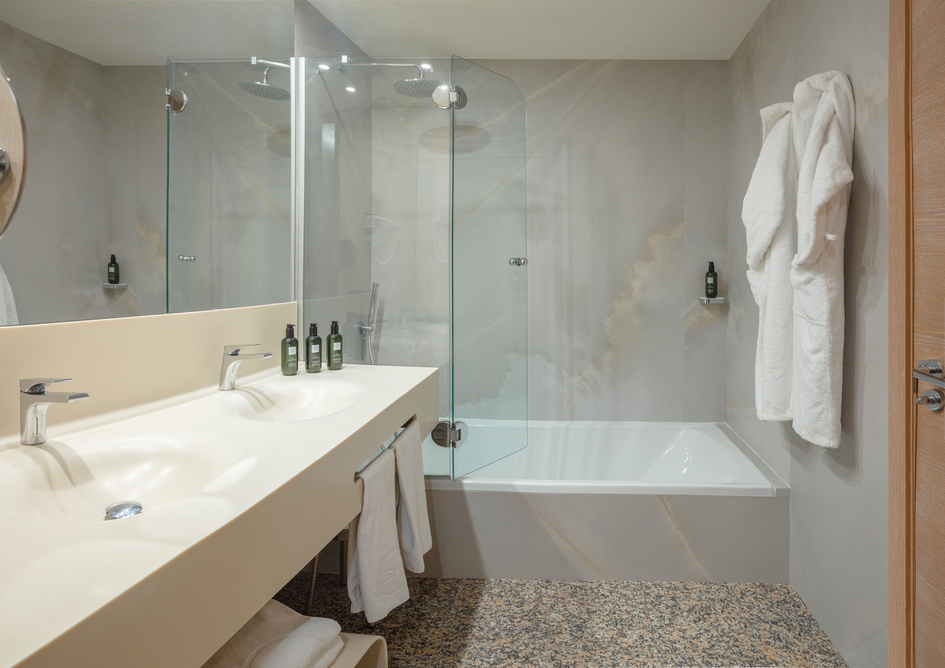 designer toiletries, hair dryer, bathrobes, slippers