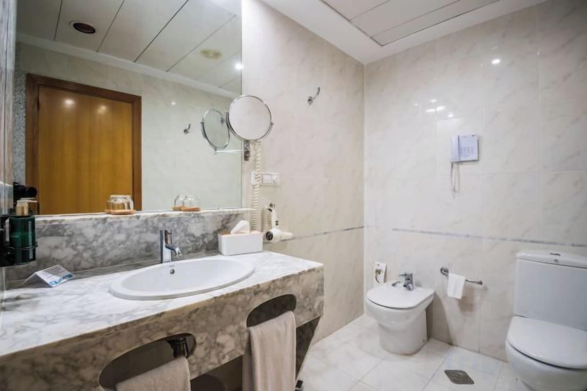 Hair dryer, towels, soap, shampoo