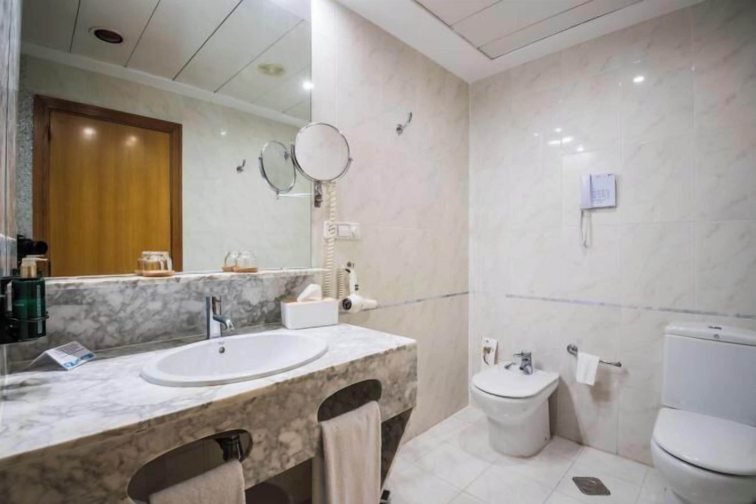 Hair dryer, towels, soap, shampoo