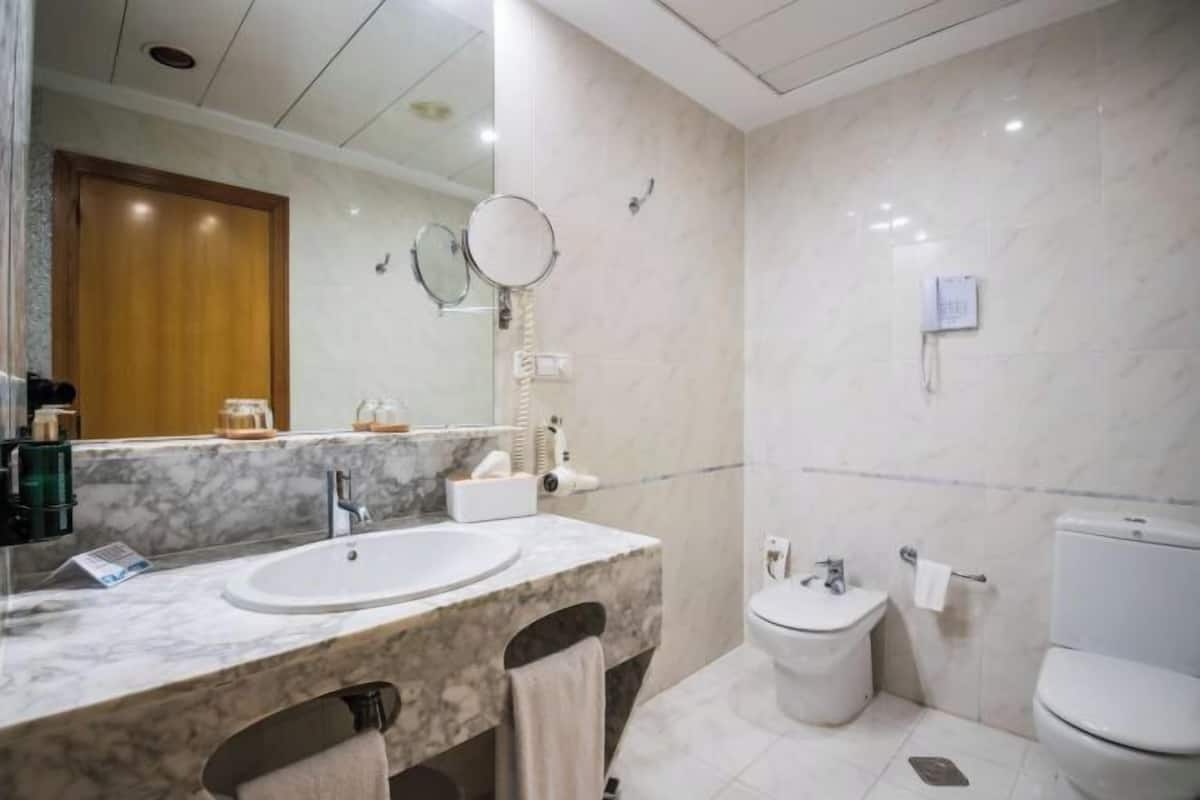 Hair dryer, towels, soap, shampoo