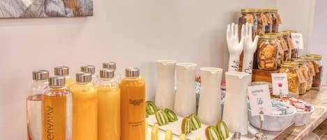 A breakfast buffet with various food items and beverages.