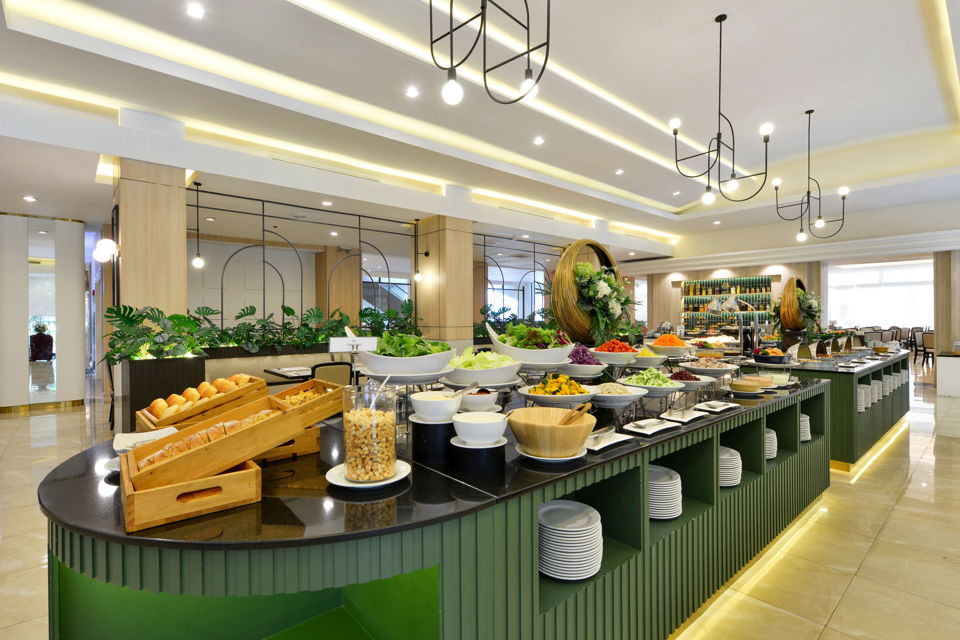 A buffet setup with various food items and a modern interior design.