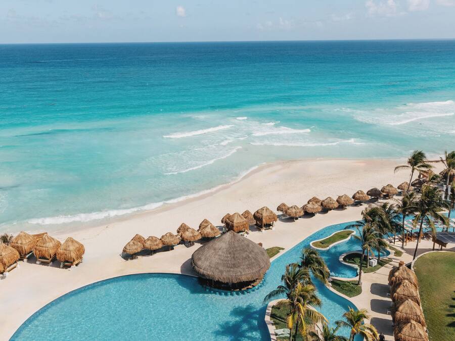 On the beach, white sand, beach umbrellas, beach towels