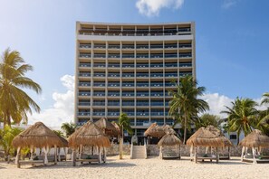 On the beach, white sand, sun-loungers, beach umbrellas