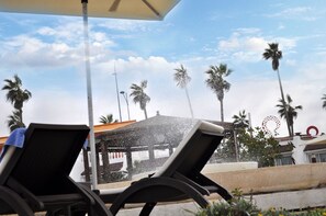 Outdoor pool, pool umbrellas, sun loungers