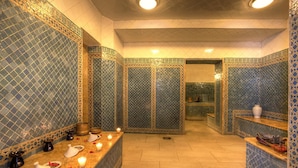 A traditional bathroom with patterned tiles, a marble counter, and a mirror. - Casablanca Le Lido Thalasso & Spa (Casablanca)