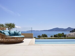 Seasonal outdoor pool, open 10:00 AM to 6:00 PM, pool umbrellas