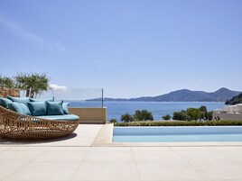 Seasonal outdoor pool, open 10:00 AM to 6:00 PM, pool umbrellas