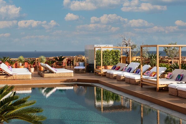 Seasonal outdoor pool, pool umbrellas, pool loungers