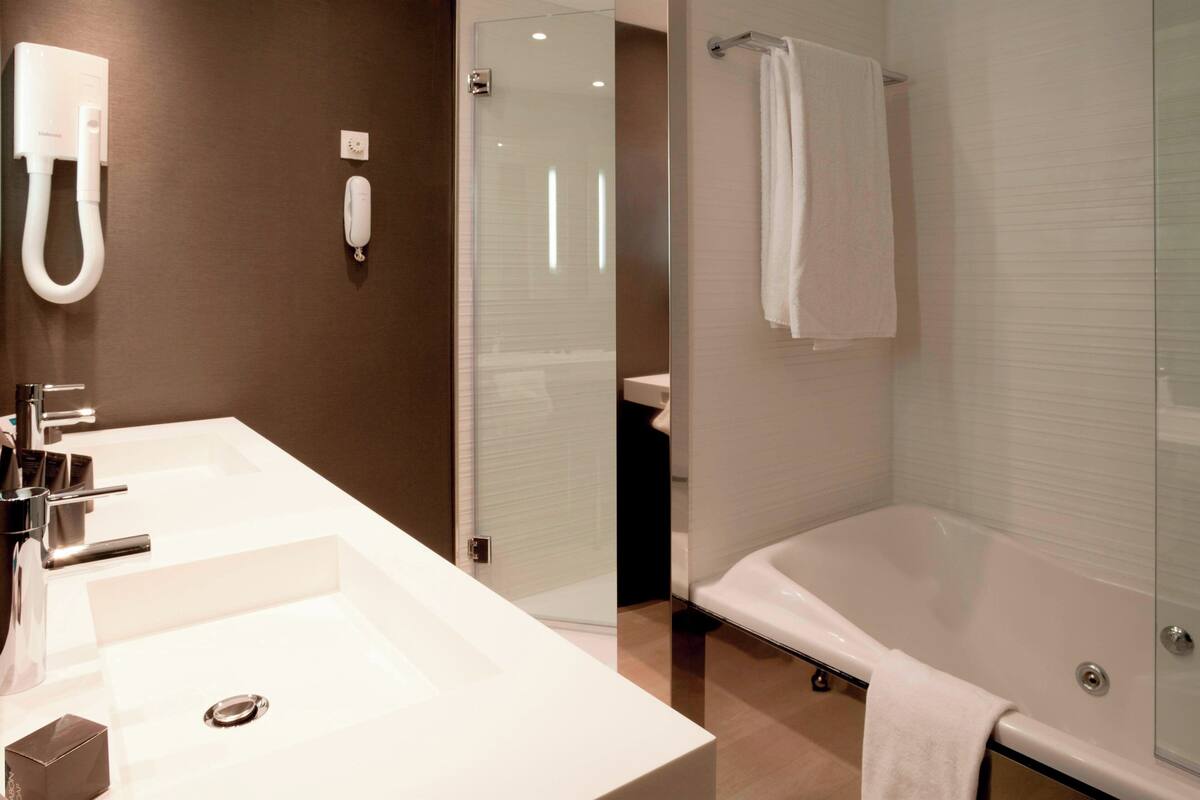 eco-friendly toiletries, hair dryer, bidet, towels