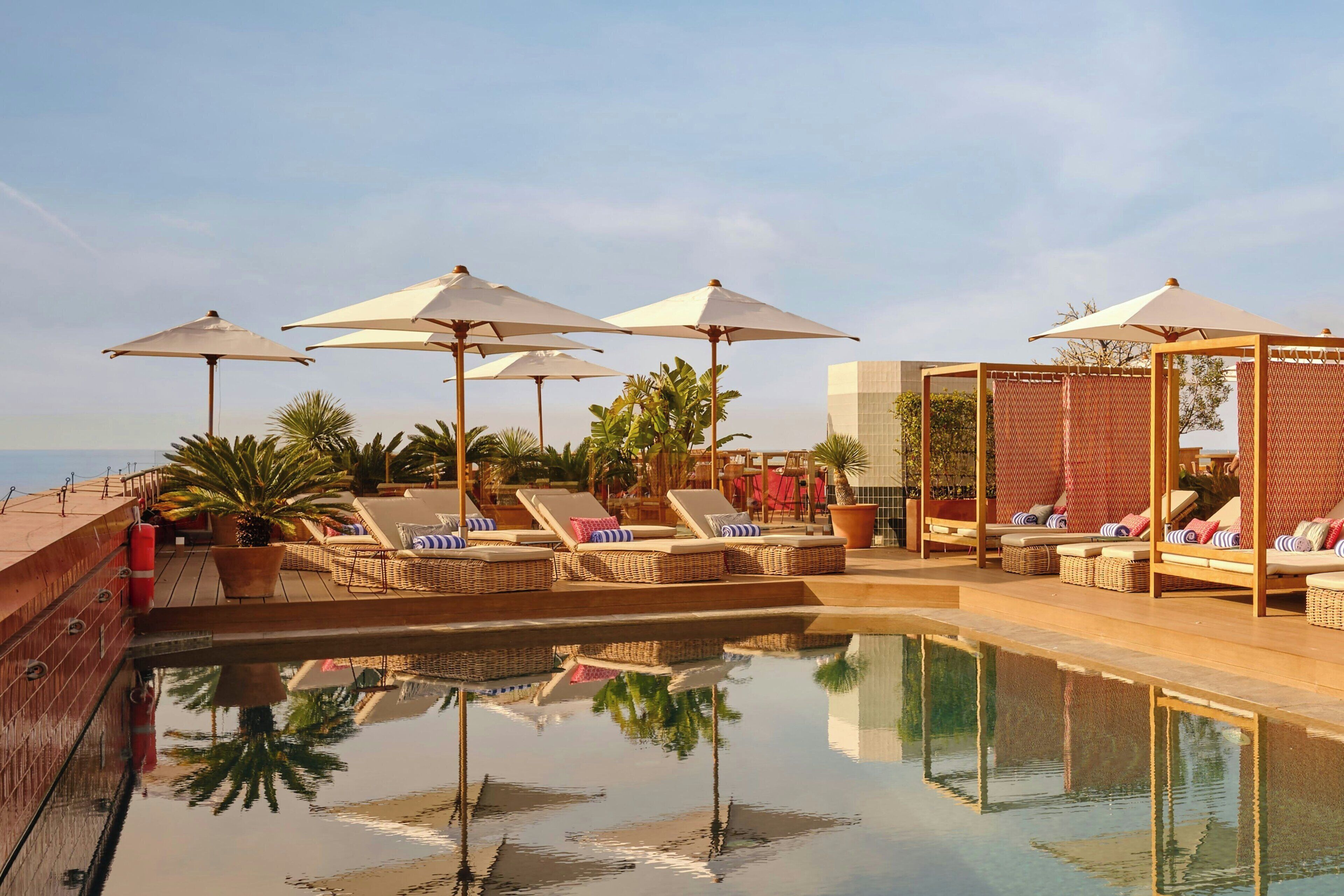 seasonal outdoor pool, pool umbrellas, pool loungers