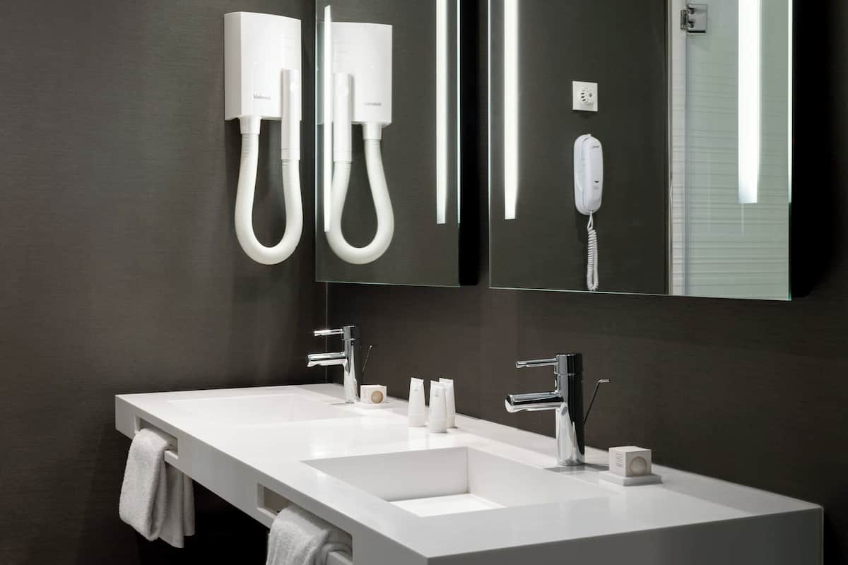 eco-friendly toiletries, hair dryer, bidet, towels