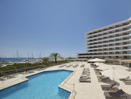 Seasonal outdoor pool, open 10:00 AM to 6:00 PM, pool umbrellas