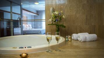 Suite | In-room safe, desk, laptop workspace, blackout curtains