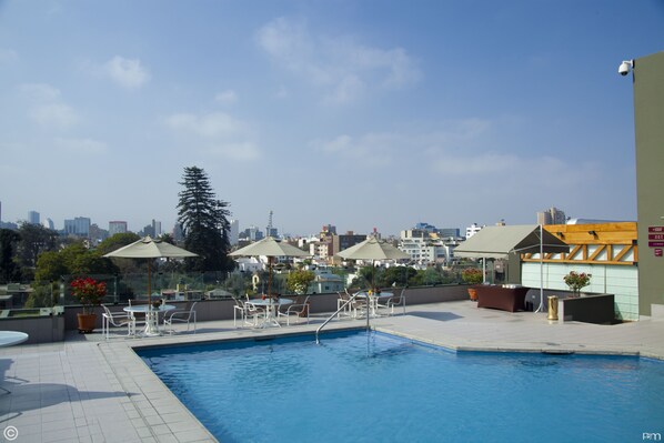Outdoor pool, open 9:00 AM to 6:30 PM, pool umbrellas, pool loungers
