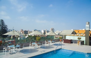 Outdoor pool, open 9:00 AM to 6:30 PM, pool umbrellas, pool loungers