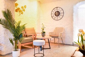 Relax in a warm, inviting space with a comfortable seating area, sofa, and two chairs.