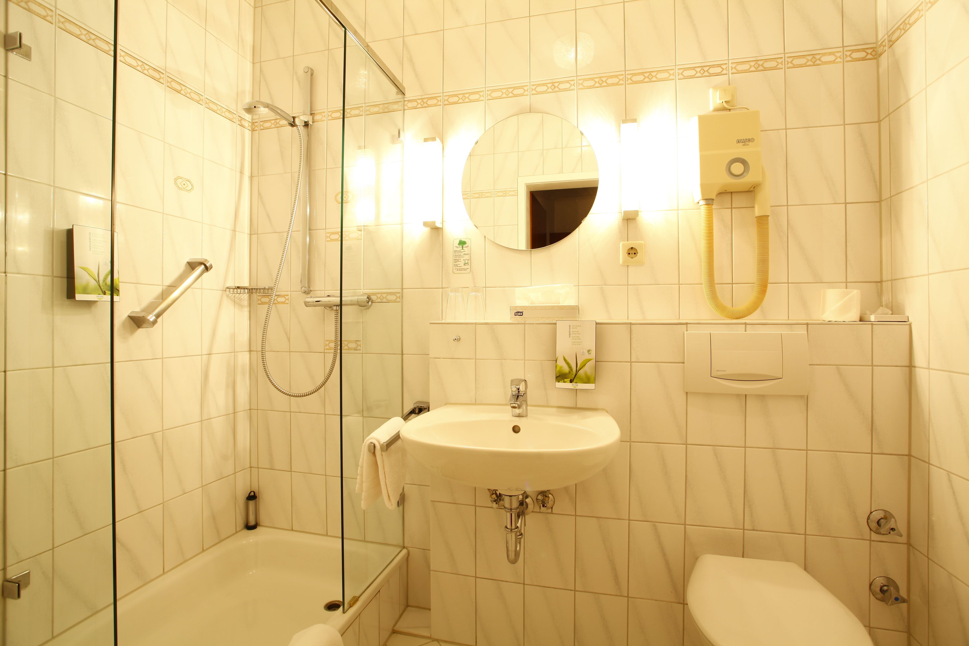 shower, designer toiletries, hair dryer, slippers