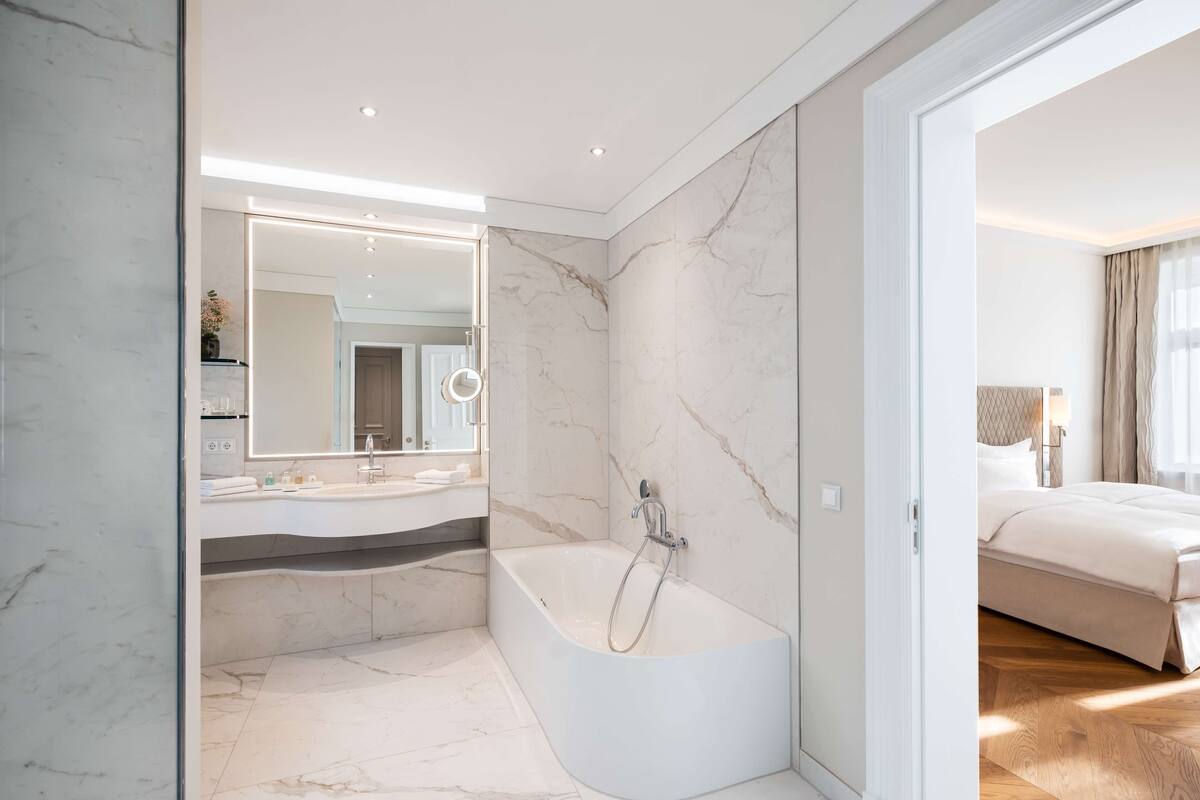 designer toiletries, hair dryer, bathrobes, slippers