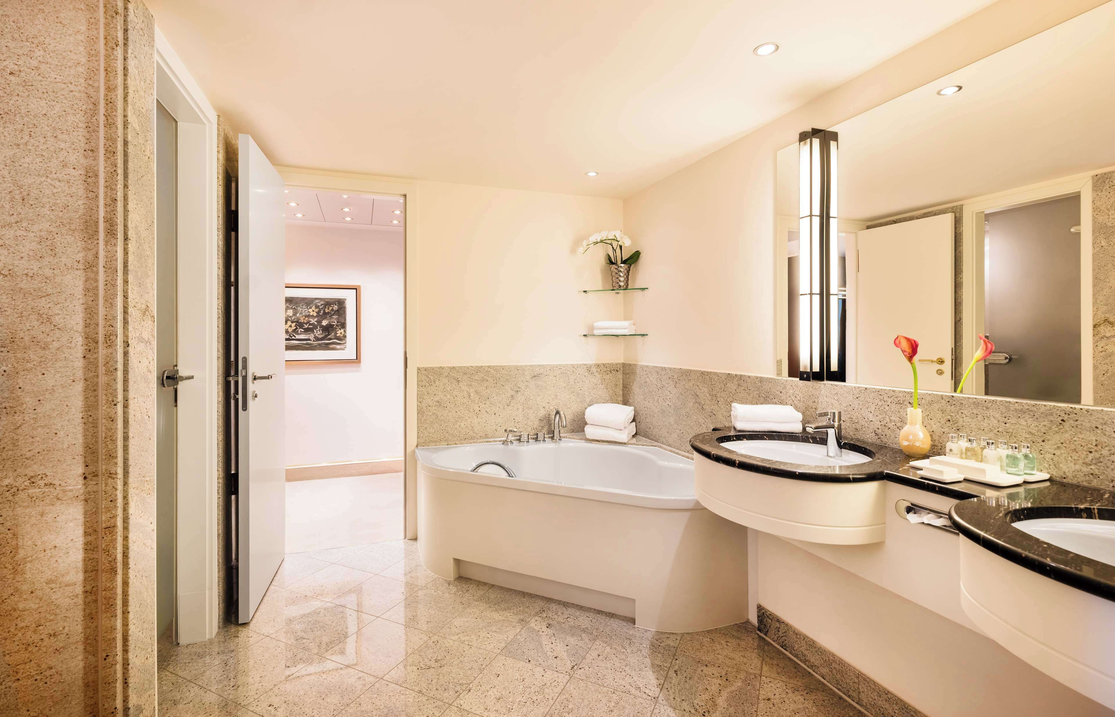 designer toiletries, hair dryer, bathrobes, slippers