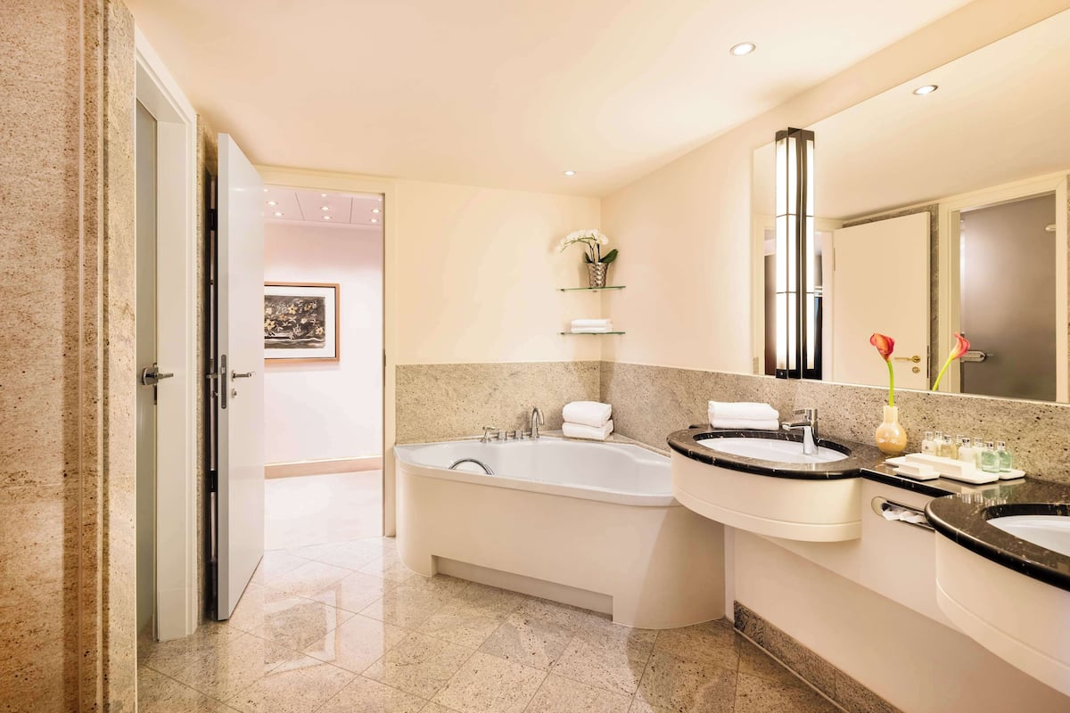 designer toiletries, hair dryer, bathrobes, slippers