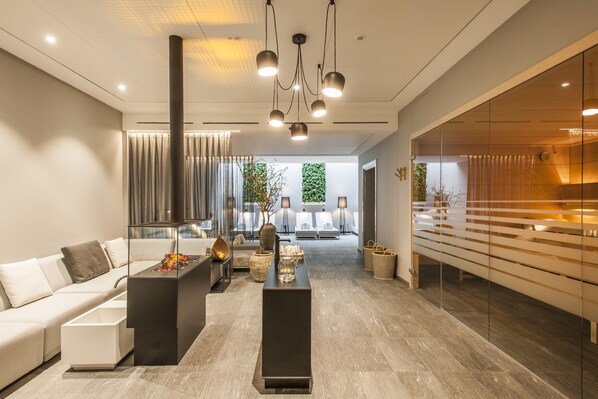 Relax in a stylish living area with a central coffee table, sofa, and glass partition.