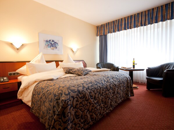 Hypo-allergenic bedding, pillowtop beds, in-room safe, desk