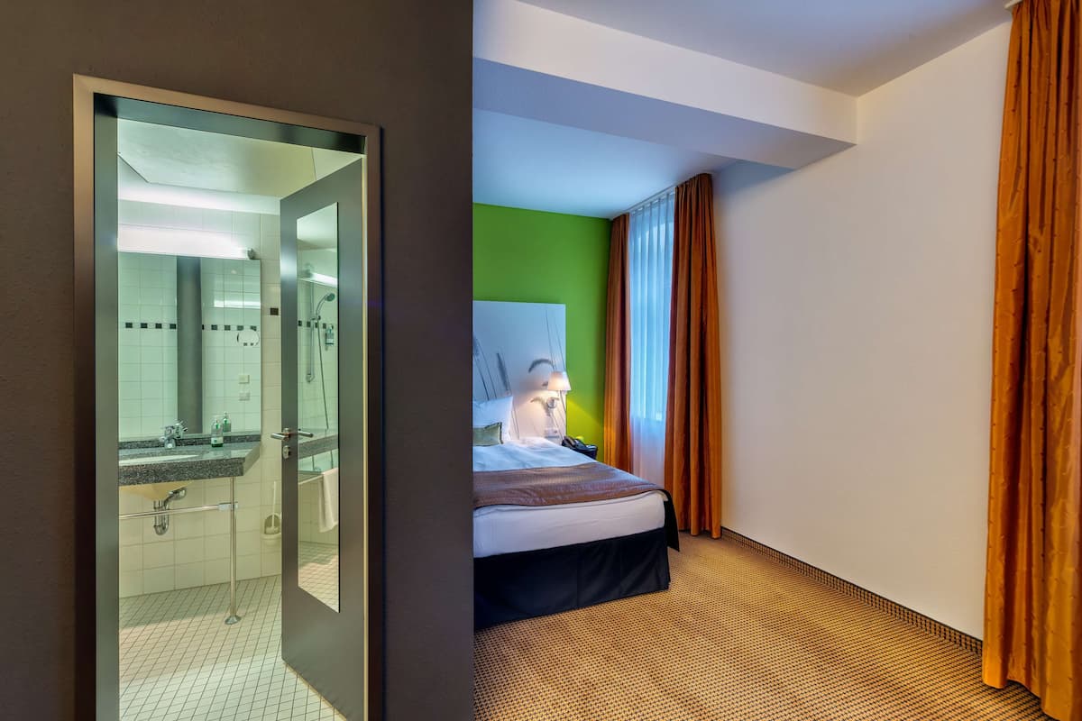 business single room | in-room safe, desk, laptop workspace, blackout curtains