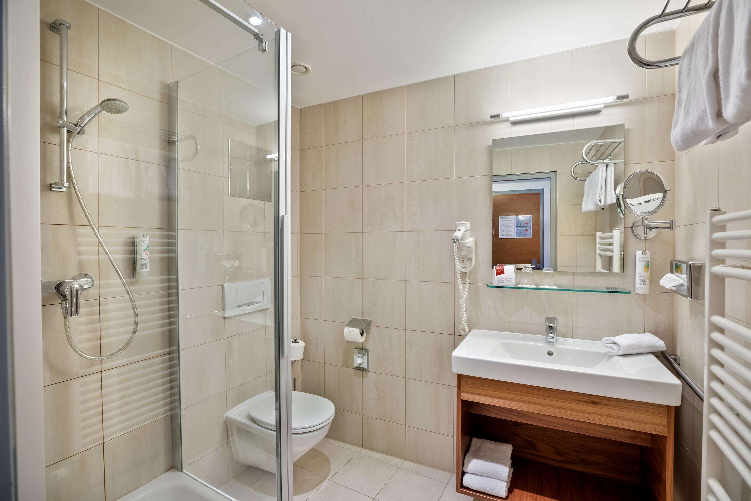 premium room | bathroom | hair dryer, towels, soap, shampoo