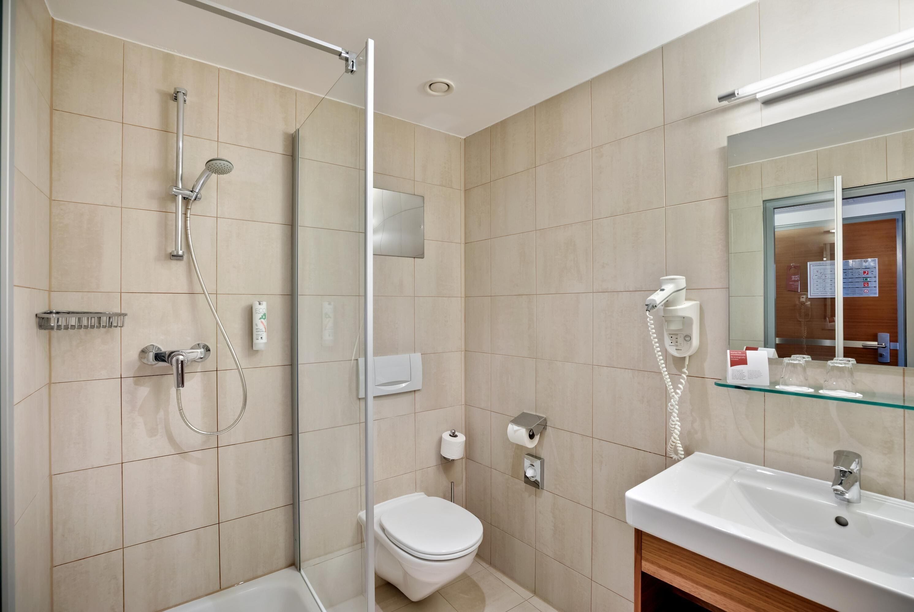 premium room | bathroom | hair dryer, towels, soap, shampoo