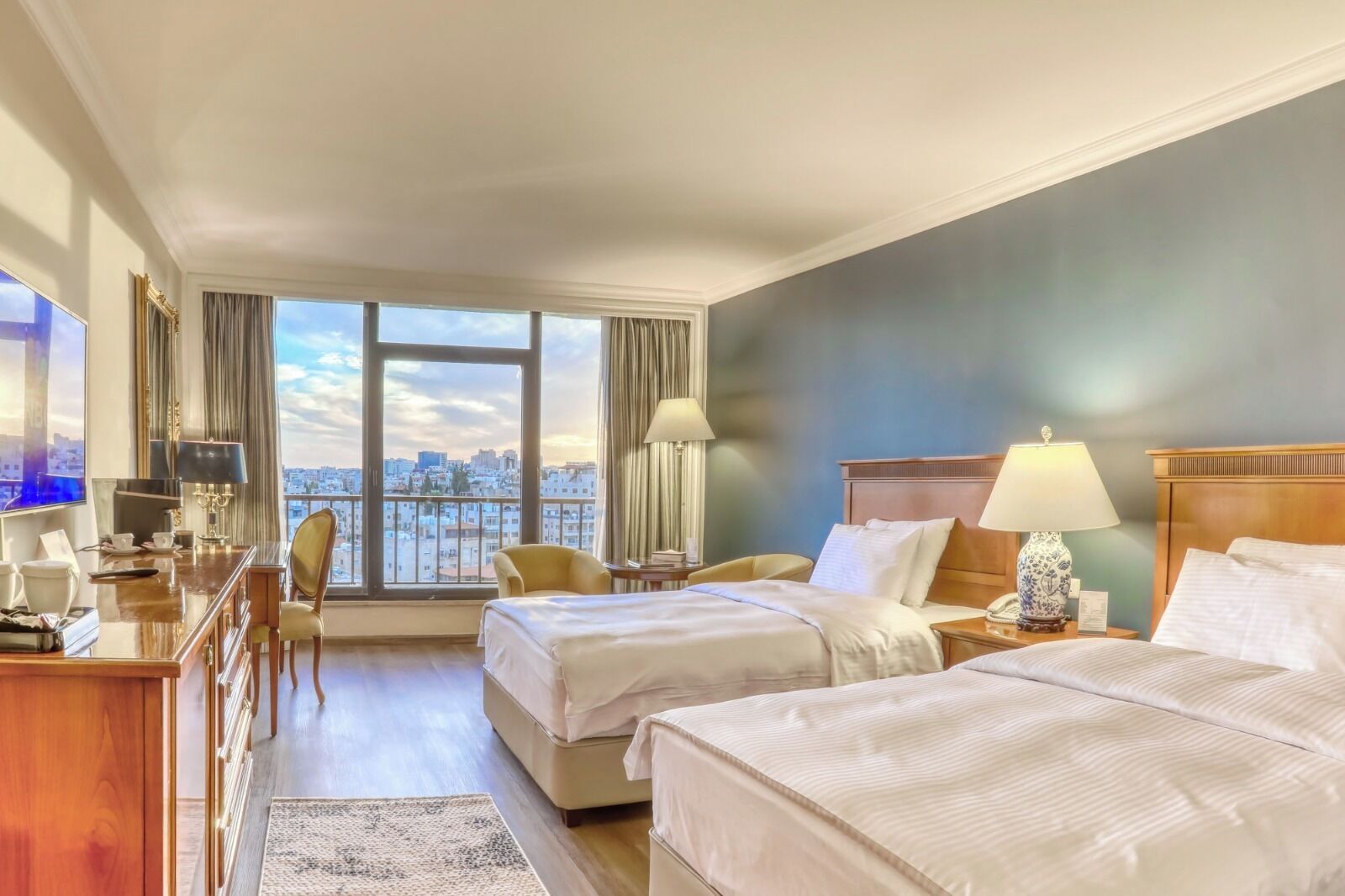 Deluxe Room | Minibar, in-room safe, soundproofing, iron/ironing board