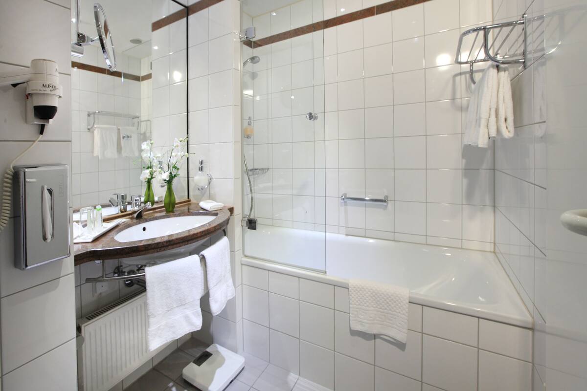 eco-friendly toiletries, hair dryer, bathrobes, towels