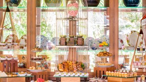 A buffet with a variety of food items and decorative glassware. - Furama Resort Danang (Da Nang)