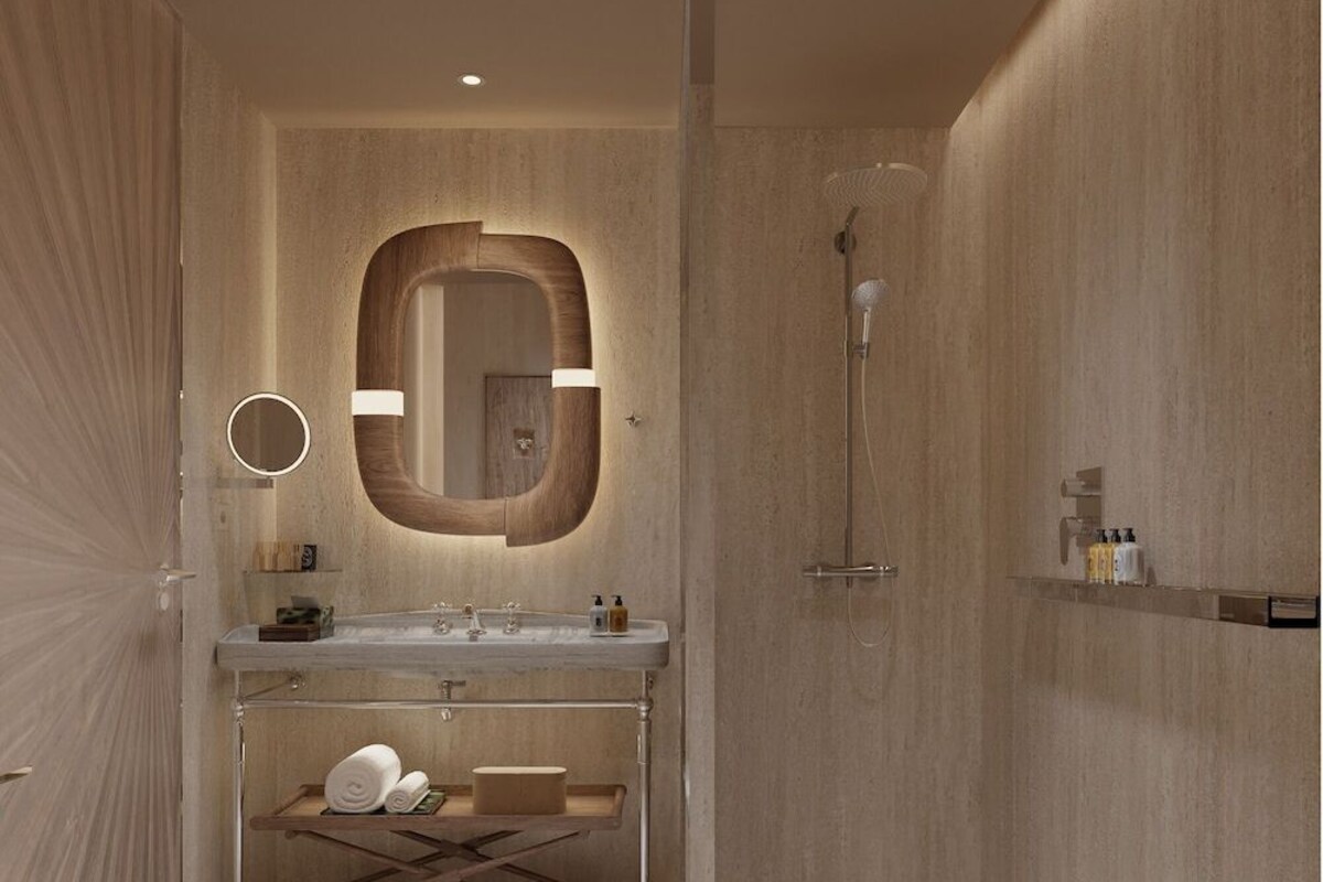A modern bathroom with a wooden vanity, a large mirror, a shower, and a towel rack.
