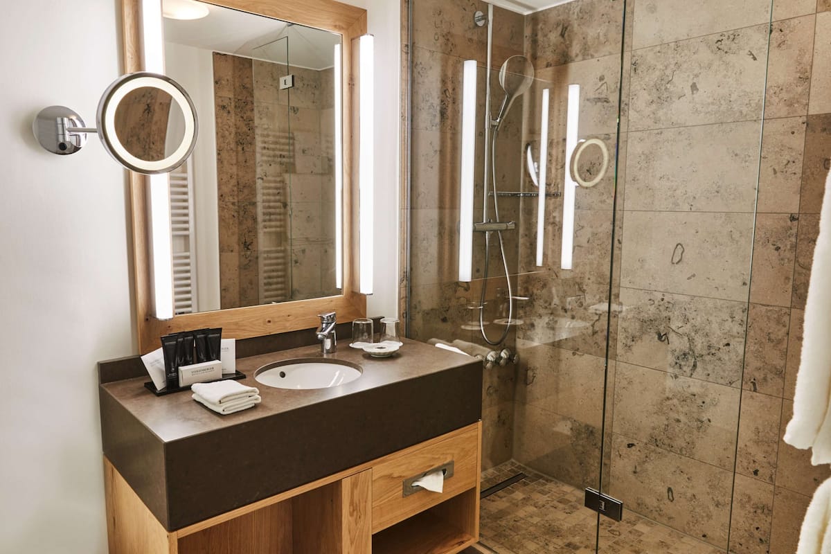 superior double room | bathroom | hair dryer, bathrobes, slippers, towels