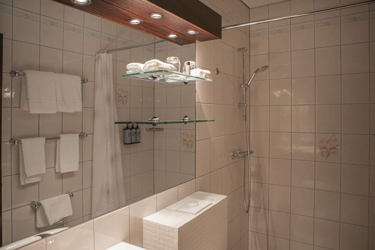 junior suite | bathroom | eco-friendly toiletries, hair dryer, bathrobes, towels