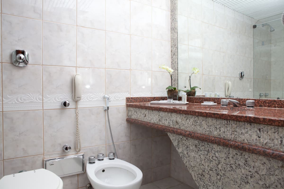 Deluxe Room, Sea View | Bathroom | Combined shower/tub, deep soaking tub, hair dryer, towels