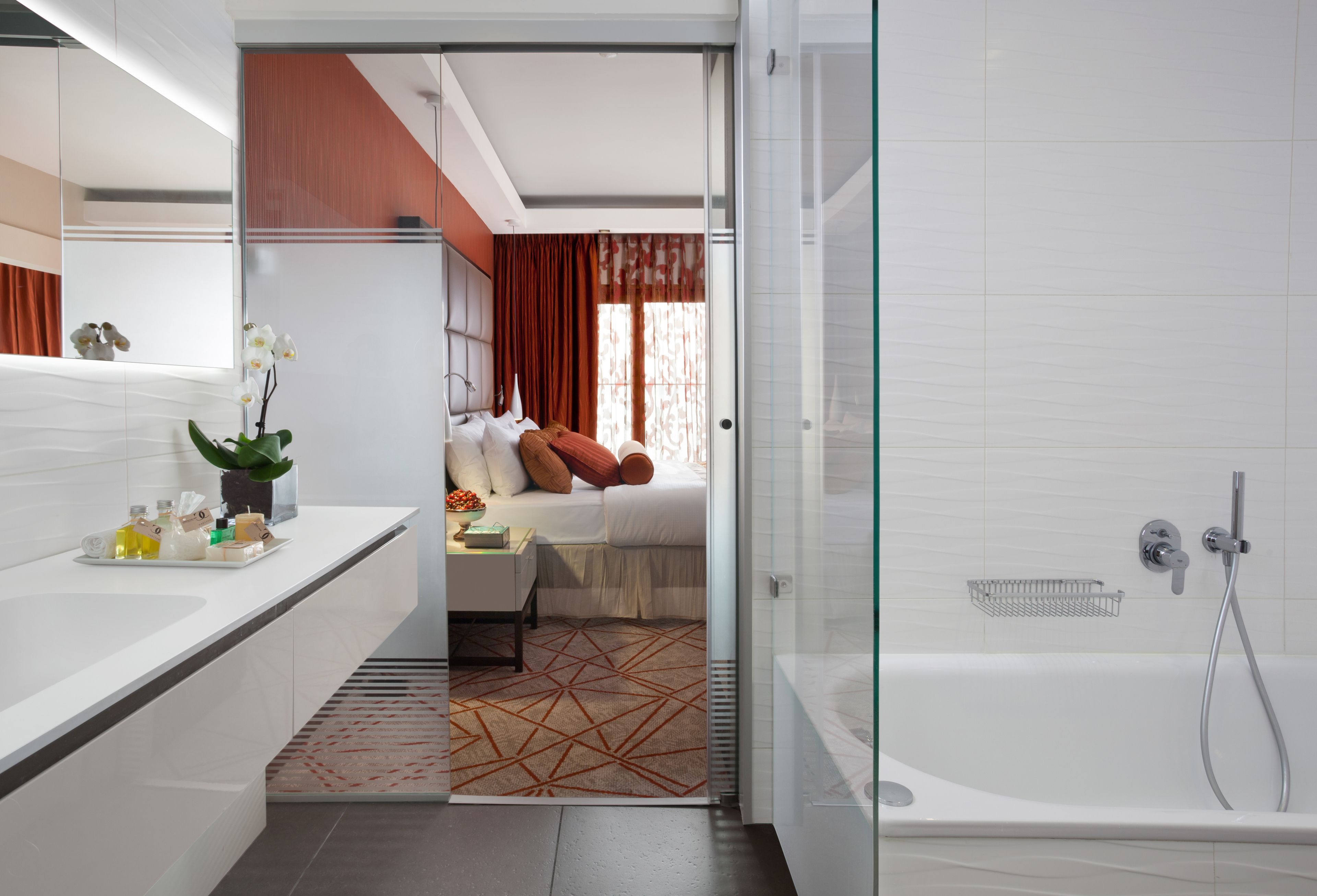 one bedroom suite with sea view | bathroom | shower, free toiletries, hair dryer, bathrobes
