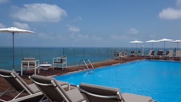 Outdoor pool, pool umbrellas, sun loungers