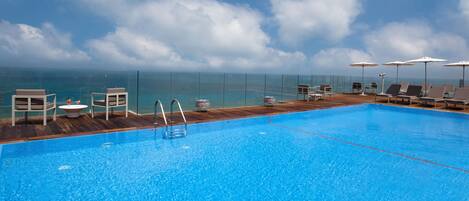 Outdoor pool, pool umbrellas, sun loungers