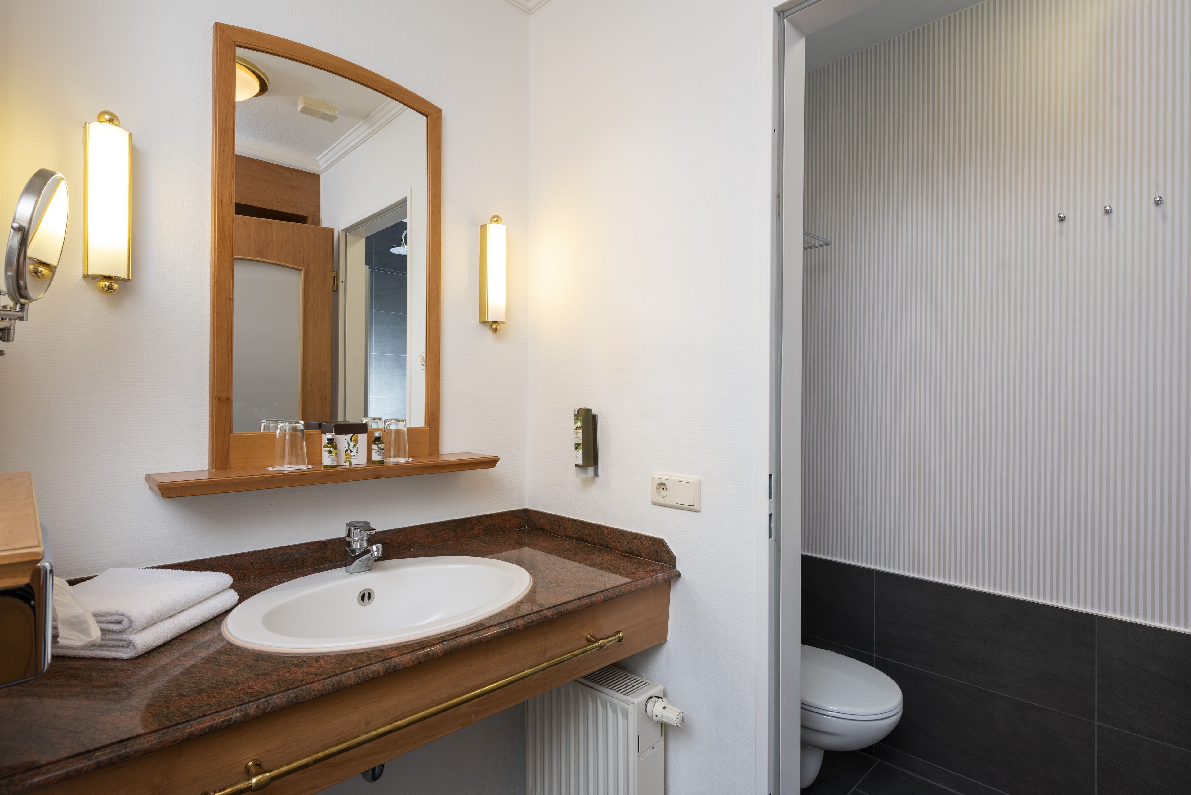 superior double room | bathroom | shower, eco-friendly toiletries, hair dryer, towels
