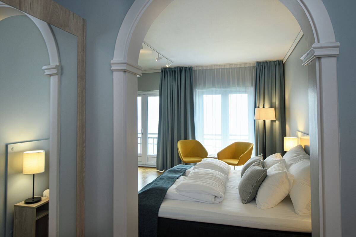 superior double room, balcony (fjord view) | living area | flat-screen tv