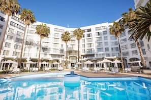 Outdoor pool, pool umbrellas, sun loungers